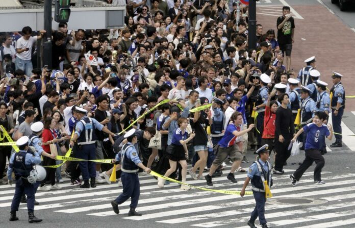 Fans watch the 2026 FIFA World Cup match between Tunisia and Japan in Tokyo